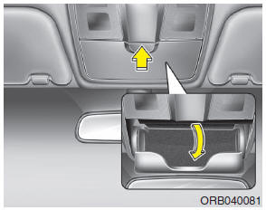 Hyundai Accent: Sunglass holder. To open the sunglass holder, press the cover and the holder will slowly open.