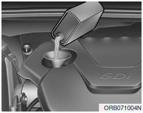 Hyundai Accent: Checking the engine oil level. 1. Be sure the vehicle is on level ground.