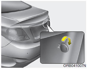 Hyundai Accent: Opening the trunk. 