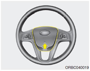 Hyundai Accent: Horn. To sound the horn, press the horn symbol on your steering wheel.