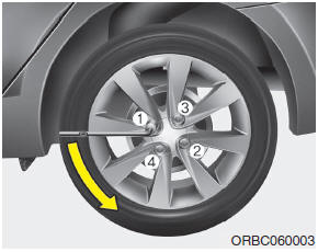 Hyundai Accent: Changing tires. 6. Loosen the wheel lug nuts counterclockwise one turn each, but do not remove