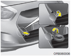 Hyundai Accent: Removable towing hook. 1. Open the trunk lid/tailgate, and remove the towing hook from the tool case.