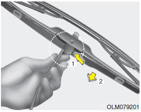 Hyundai Accent: Blade replacement. 2. Compress the clip and slide the blade assembly downward.