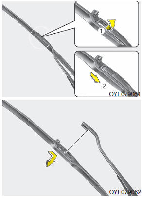Hyundai Accent: Blade replacement. 2. Lift up the wiper blade clip. Then pull down the blade assembly and remove