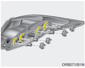 Hyundai Accent: Rear combination light bulb replacement (4 Door). 3. Remove the socket from the assembly by turning the socket counterclockwise