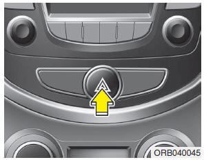 Hyundai Accent: Hazard warning flasher Hyundai Accent: Hazard warning flasher. The hazard warning flasher should be used whenever you find it necessary to stop