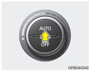 Hyundai Accent: Automatic heating and air conditioning. 1. Press the AUTO button.